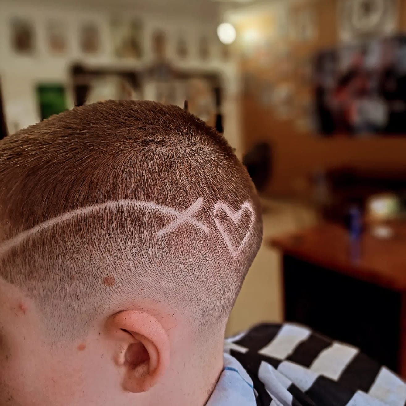 Buzz cut with heart design above the ear